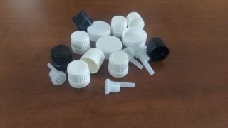 Tapas y atomizadores para botellas perfumeras